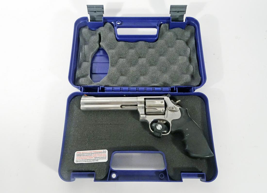 Smith & Wesson Model 686-5 Stainless Steel Revolver: Smith & Wesson model 686-5 stainless steel revolver, double action, .357 caliber, 7 shot, serial number CDK3670, barrel length 6", overall length 11", comes with hard side carry case, and adjustable r