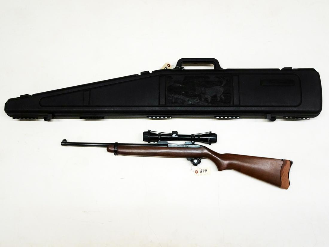 Ruger Carbine Model Rifle: Ruger Carbine model rifle with Tasco Pronghorn scope and hard side carry case, semi-automatic action, .44 mag caliber, approx.. 5 shot, tube feed, serial number 10279997, barrel length 18 1/2", overal