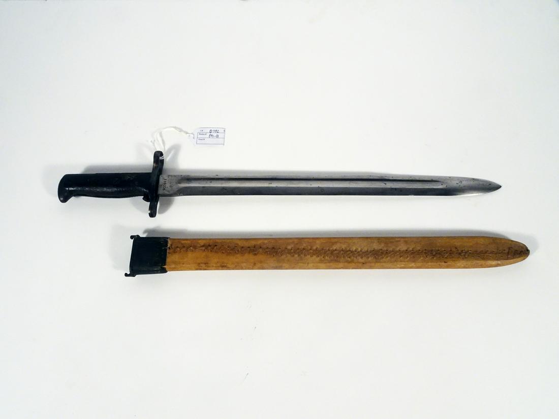 WW1 U.S. M1905 Bayonet: WW1 U.S. M1905 bayonet, 16" length straight blade with fuller groove, ricasso is marked "US 118006", the obverse is marked "RIA 1907", wood handle, original iron and leather covered scabbard, 21 1/2" 