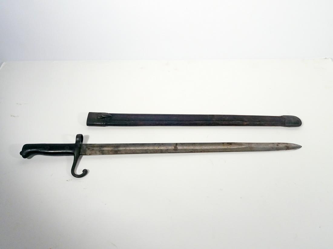 WW1 Italian Vetterli Bayonet: WW1 Italian Vetterli bayonet, 20 1/4" straight blade with fuller groove, ricasso is stamped with an illegible mark, wood handle, original leather scabbard is stamped on 1 side "Torino 1880",