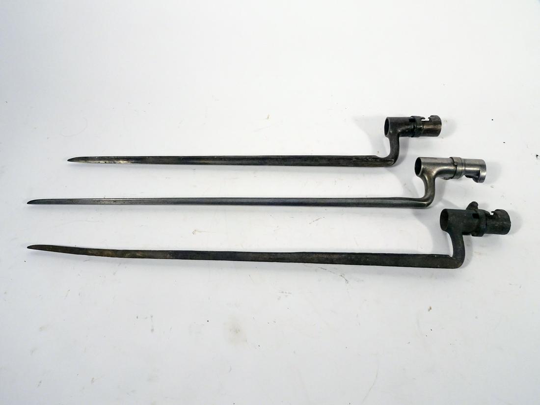 Group of Three Socket Bayonets: Group of three socket bayonets, 16" straight blade with fuller groove and guard stamped "3C1" and two with 18" straight blades with fuller groove, 1 with ricasso stamped "US", 19" and 20 1/2" overall 