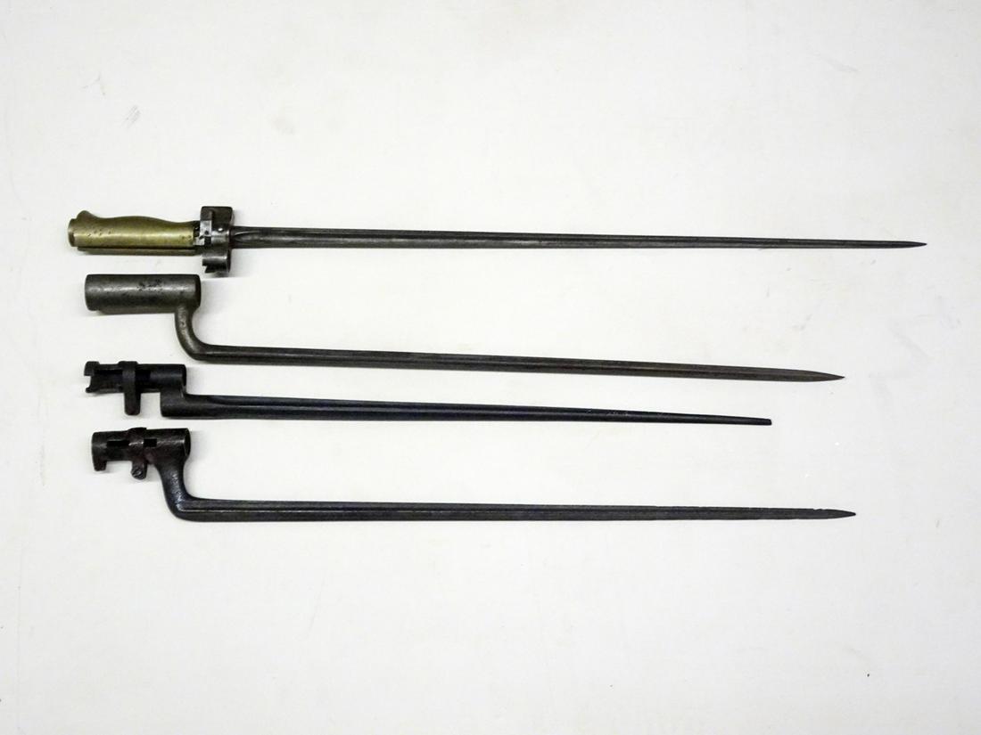Group of Four Spike Socket Bayonets: Group of four spike socket bayonets with triangular edge blades, 16", 16 1/4", 19" and 20 1/4" blades, guard for 20 1/4" is stamped "F 62745", 19 3/4", 21 3/4", 22" and 25 1/4" overall length