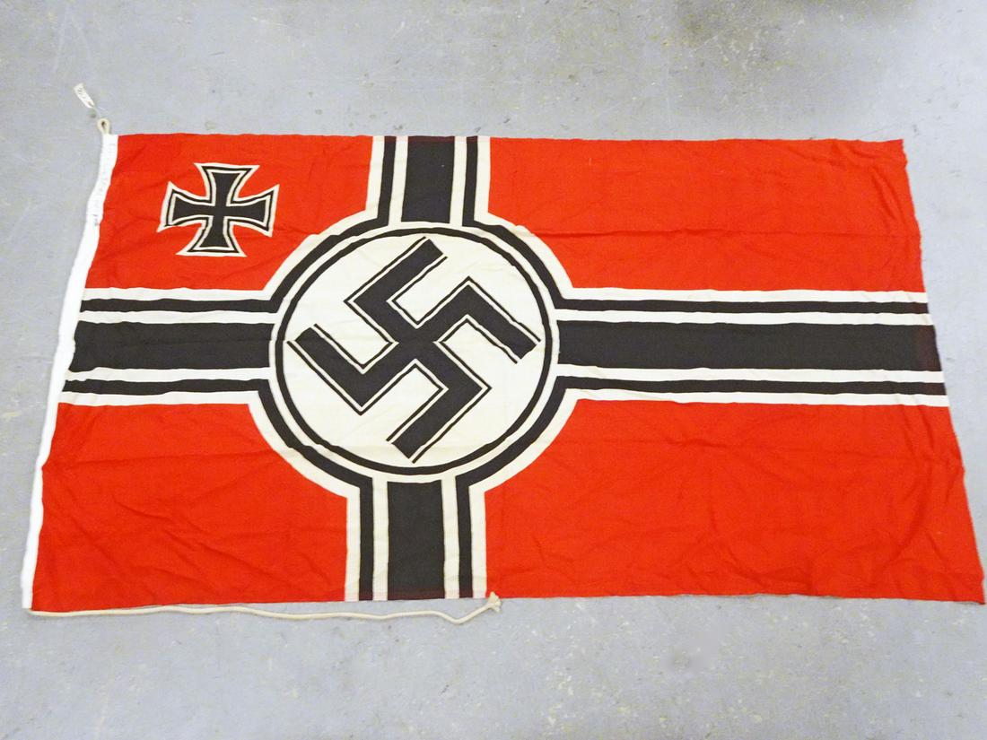 WWII German Nazi Kriegsmarine Flag: WWII German Nazi Kriegsmarine flag, with a swastika and an iron cross in the upper corner, heavy sewn in mounting rope, border marked "LOH. KR-FL. 150 x 350", also marked with an "M", measures 99" (he