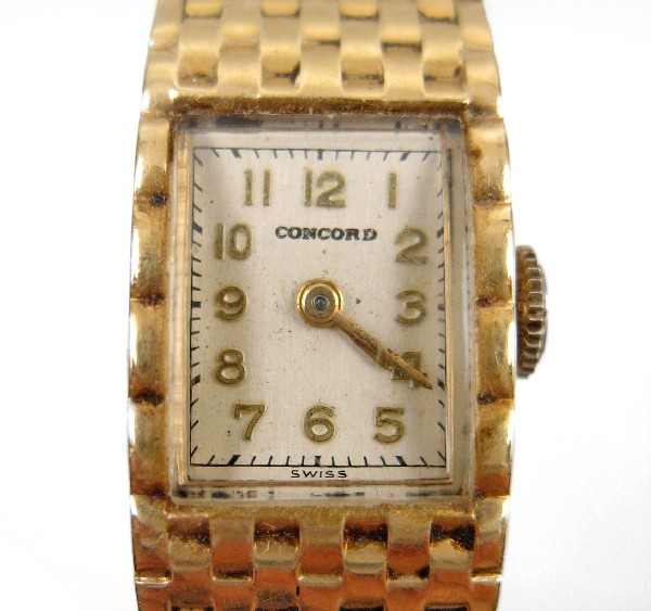 Lady's 14k yellow gold Concord wristwatch with mes: Lady's 14k yellow gold Concord wristwatch with mesh band, case and band are 14k gold, case marked inside Jules Jurgensen 14k 432492, works marked Concord Watch Co. 17 Jewels Swiss, 6 1/2" long x 5/8" 
