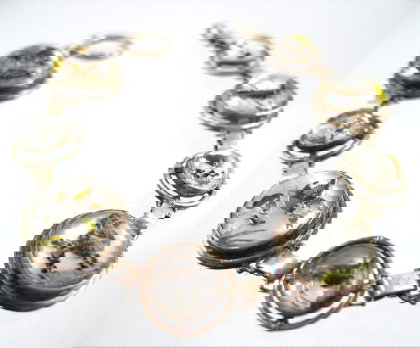 Sterling silver and crystal bracelet with intaglio: Sterling silver and crystal bracelet with intaglio figures including hunting dogs and horses, mother of pearl backs, bracelet measures 7 1/4" long x 5/8" wide, marked sterling, early 20th C.