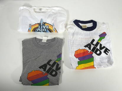 Live Aid Concert T-Shirt Grouping: Three piece 1985 Live Aid concert t-shirt grouping, all are size L, grey shirt is sleeveless