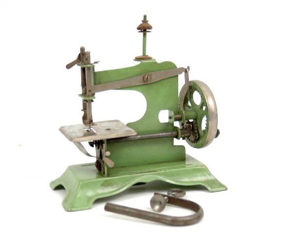 Green metal child's sewing machine, unmarked, C. 1: Green metal child's sewing machine, unmarked, C. 1930's