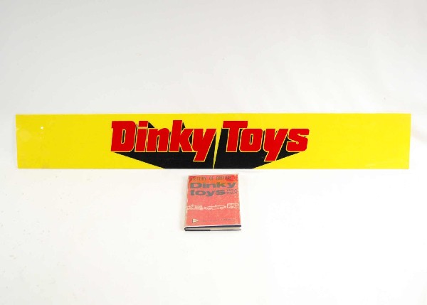 Large plastic Dinky Toys sign 46 1/2" x 6 1/2" and: Large plastic Dinky Toys sign 46 1/2" x 6 1/2" and book "History of British Dinky Toys, 1934 - 1964" by Cecil Gibson, signed by the author and dated 1972