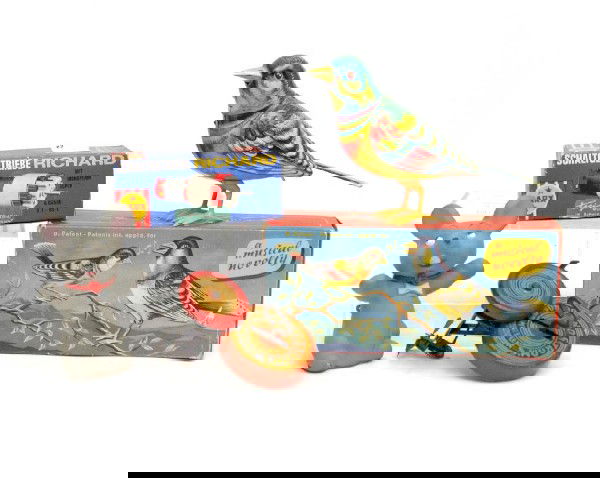 Four toys including vinyl wind-up mouse, West Germ: Four toys including vinyl wind-up mouse, West Germany wind-up bird with box (missing key), Marx power-drive Richard with box and Lindstrom's outboard motor (gears don't mesh)