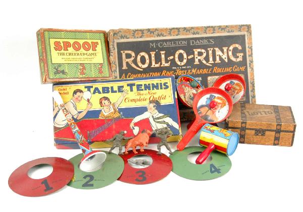 Four early games, five metal noise makers, games i: Four early games, five metal noise makers, games include M. Carlton Dank's Roll-O-Ring C. 1920's (missing marbles), Transogram Gold Medal Table Tennis No. 666 C. 1930's, Milton Bradley Spoof, the Chee
