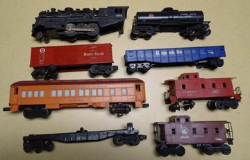 Lionel engine and seven cars: includes engine #1666, Gulf tank car #6025, Baby Ruth freight car #X6014, flat bed car #6424, City of Milwaukee passenger car #9500, Republic Steel #9136, brown caboose #9069, red caboose #6257