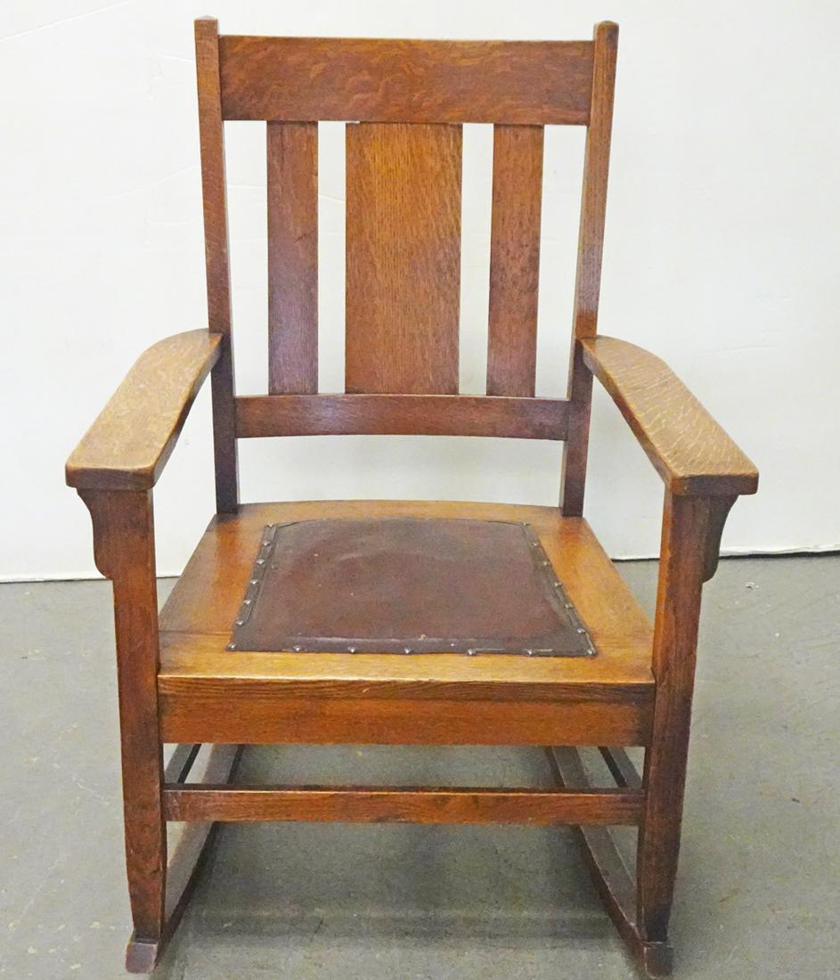 W.F. Whitney Arts and Crafts Oak Rocking Chair: W.F. Whitney Company Arts and Crafts era mission oak rocking chair, original leather seat, signed on underside of base with partial W.F. Whitney & Co. label