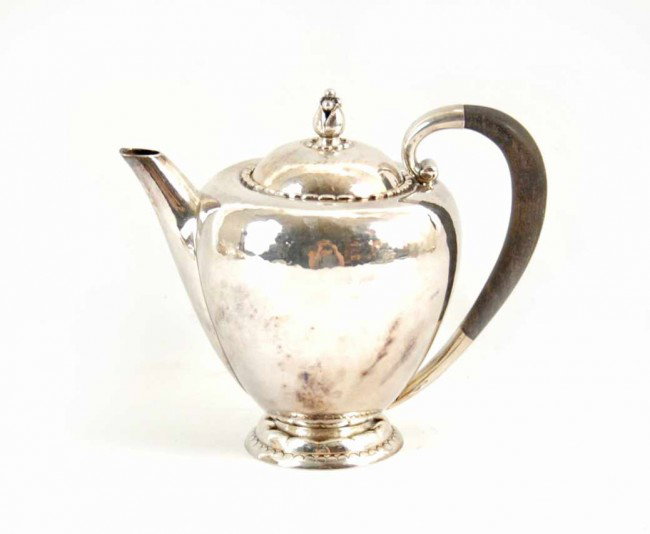 Georg Jensen sterling silver teapot, marked 34B De: Georg Jensen sterling silver teapot, marked 34B Denmark Sterling, 6" high x 6 1/2" across x 4 1/2" deep, 11.84 oz. (troy), mid 20th C.