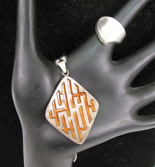 David Andersen sterling silver ring and pendant, m: David Andersen sterling silver ring and pendant, modern freeform adjustable ring, 3/4" long, marked David Andersen Norway Sterling 925S, and diamond shaped pendant with orange enameling, 2" long from