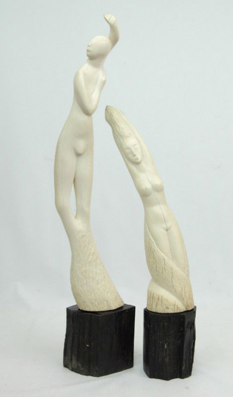 Clara Nathanson, two carved bone female figures, e: Clara Nathanson, two carved bone female figures, each on ebony bases, 17 1/2" high and 23 1/2" high, early 20th C. Russian American