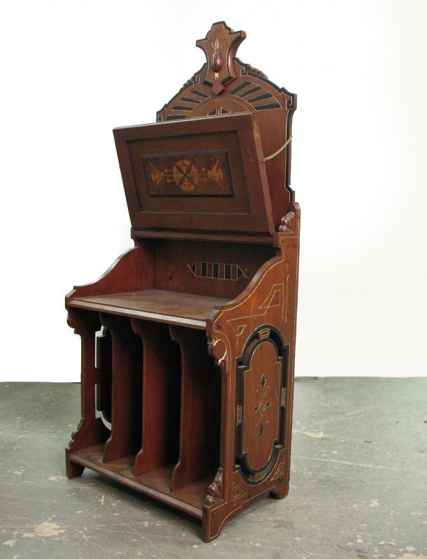 Victorian walnut Aesthetic inlaid sheet music foli: Victorian walnut Aesthetic inlaid sheet music folio stand, front panel inlaid with musical instruments, the lower section contains four vertical music slots, late 19th C., measures 46 1/2" high x 19" 