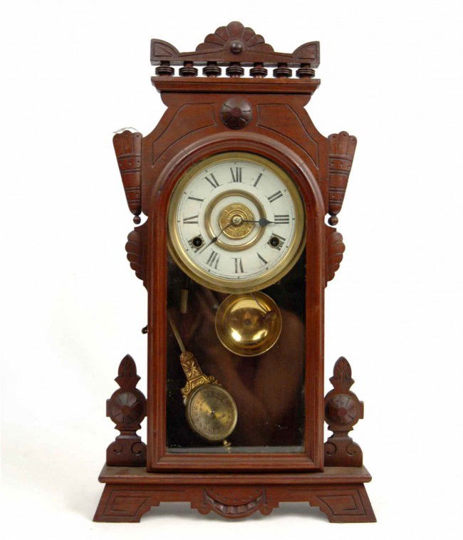 Walnut cased kitchen shelf clock, New Haven partia: Walnut cased kitchen shelf clock, New Haven partial paper label, 8 day, striking, late 19th C., measures 19 1/2" high x 11" across x 4" deep