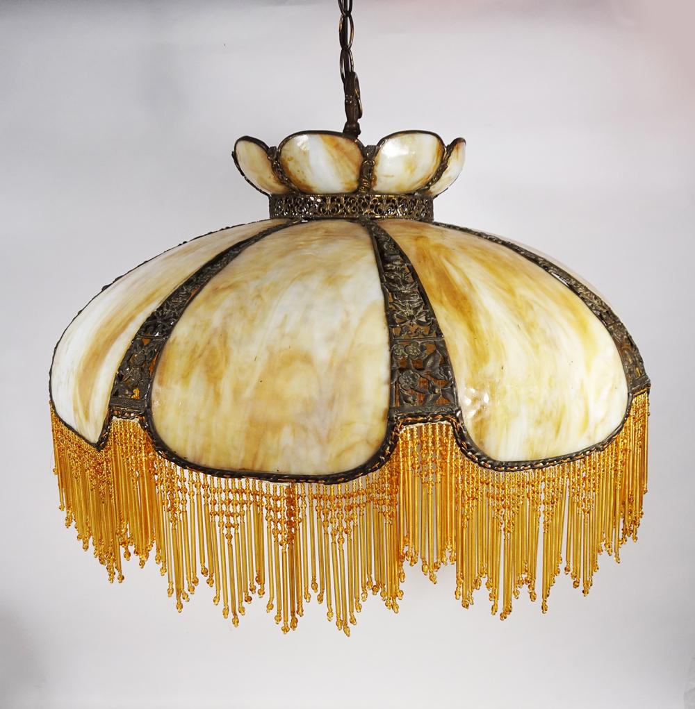 Slag Glass Chandelier w/Beaded Fringe: Slag glass chandelier with beaded fringe, openwork floral design metal frame with eight carmel and opalescent slag glass panels, top portion with eight carmel and opalescent slag glass panels, amber/y