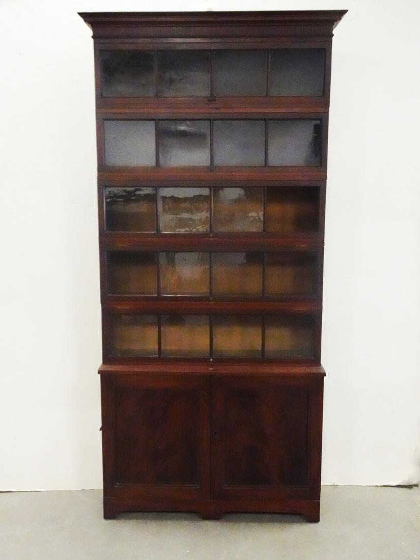Mahogany Sectional Bookcase on Cabinet Base: Mahogany sectional bookcase on cabinet base, five sectional bookcases with glass panel lift up doors, cabinet base with handles, recessed panel doors and bracket feet, early 20th c., unknown manufactu