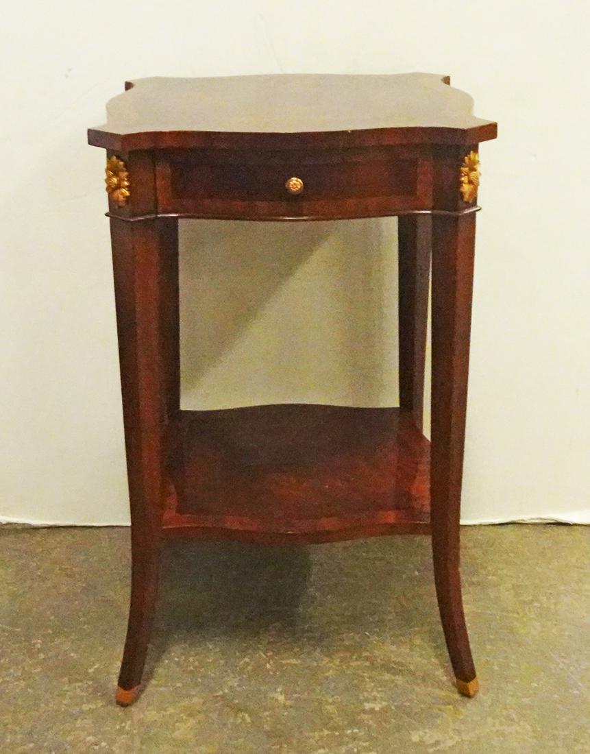 Maitland-Smith Banded Mahogany Stand: Maitland-Smith banded mahogany stand, with one drawer and undershelf, brass medallions and feet