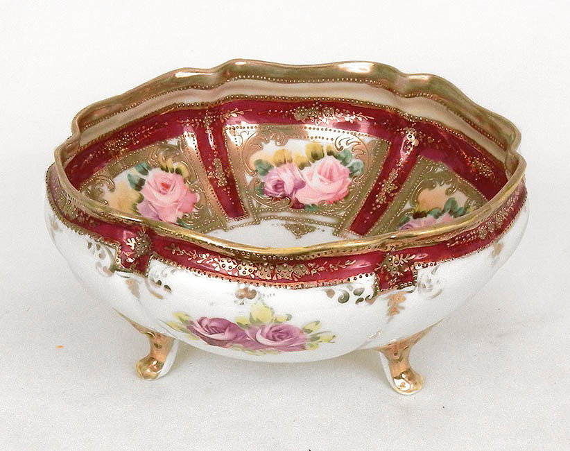 Nippon hand painted and gilt enameled footed bowl, : Nippon hand painted and gilt enameled footed bowl, paneled rose decoration, blue maple leaf mark on bottom, 4" high x 7" diameter, early 20th C.