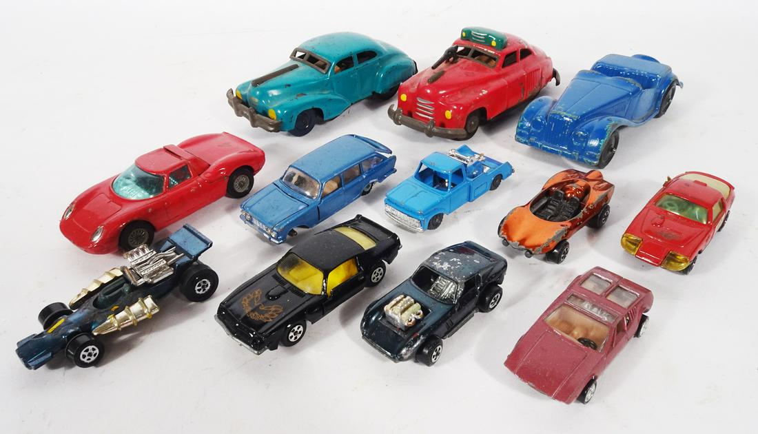 Twelve 1950's-70's tin and die-cast cars.: Twelve 1950's-70's tin and die-cast cars. Lot consists of two painted tin Japanese friction cars, one is painted red with a machine gun sticking out of the hood and what is supposed to be police light