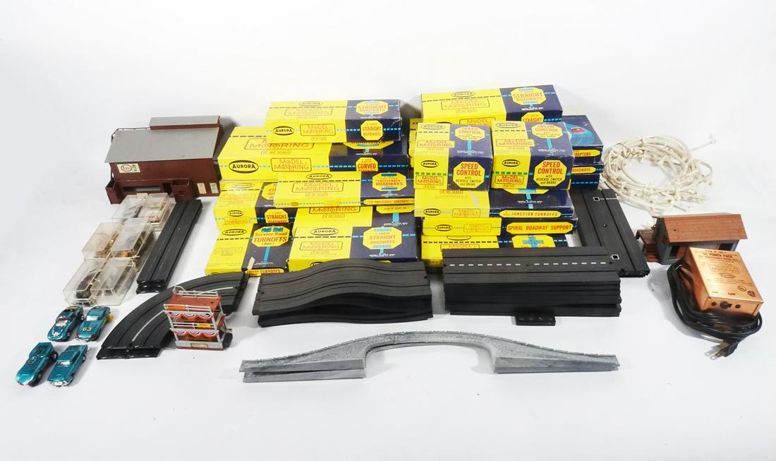One large lot of 1960's Aurora  T-jet HO scale race cars, boxed track, and loose accessories. (1 of 3)