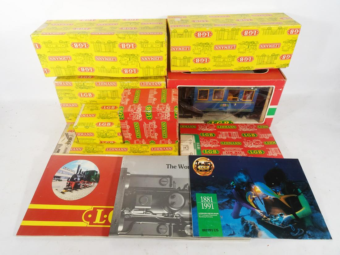 1980's LGB trains and boxes in G gauge.: 1980's LGB trains and boxes in G gauge. Lot consists of a #2001 single man hand car, a 4040 red Esso European tank car, a European style passenger car that has a customized interior, and several empty