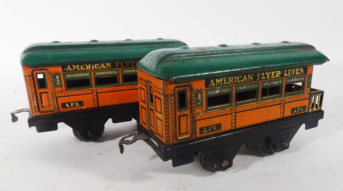 Four 1920's tin litho passenger cars by Bing and American Flyer. (1 of 3)