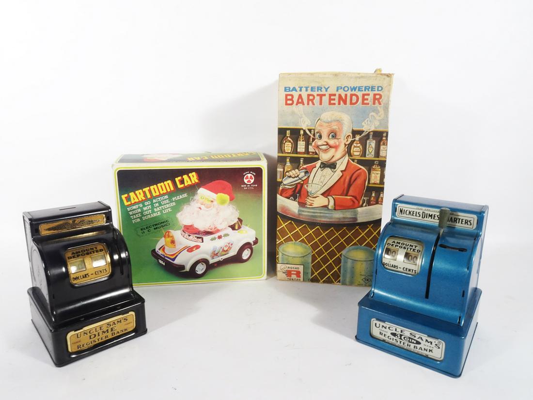 Two battery operated toys and two Uncle Sam cash register banks. (1 of 4)