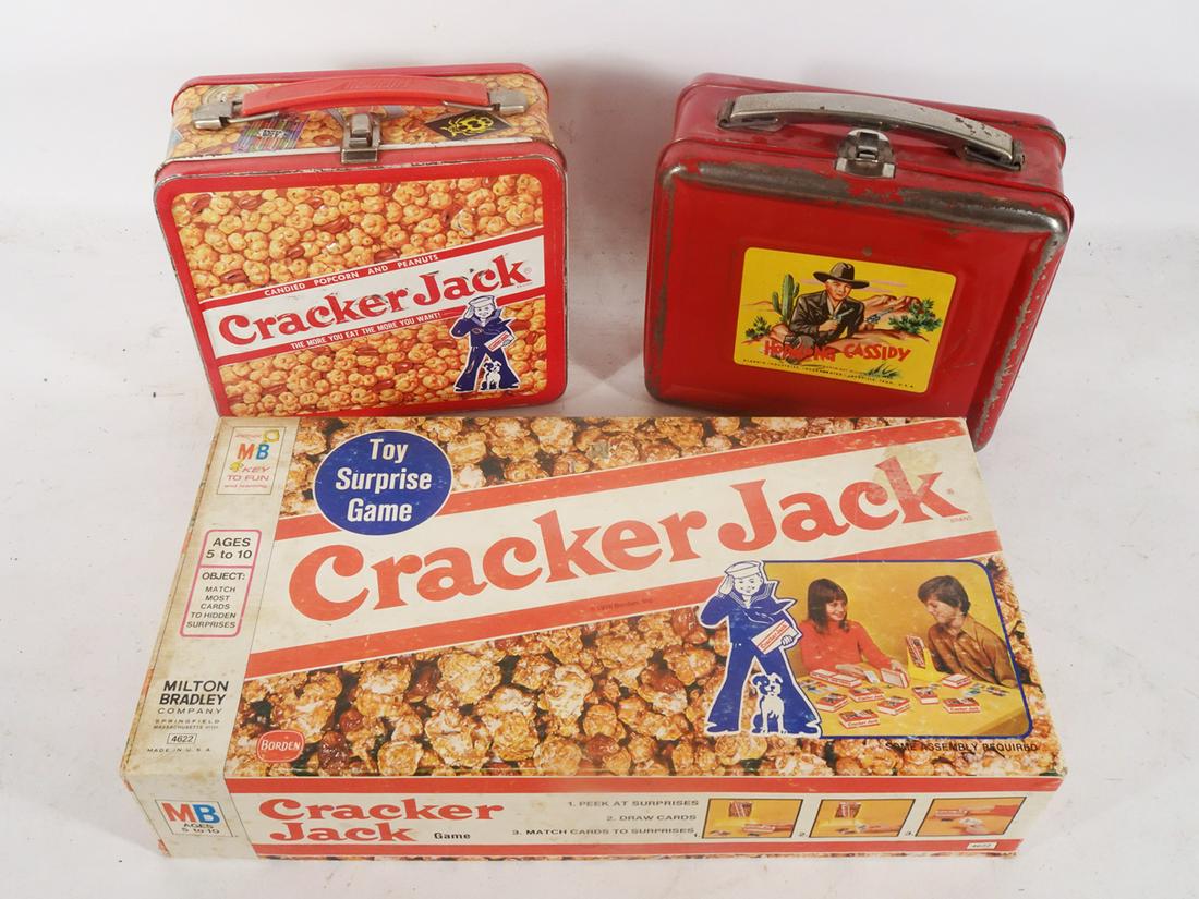 Two metal lunchboxes with thermoses and a 1976 Cracker Jack surprise game. (1 of 4)