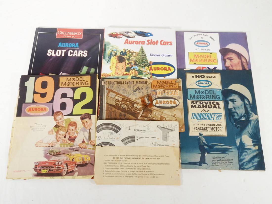 One lot of Aurora slot car collectors books and original paperwork.: One lot of Aurora slot car collectors books and original paperwork. Lot consists of a Greenberg's guide to Aurora slot cars (1995), a Complete Guide to Aurora AFX slot cars by Bob Beers (2000), and Au