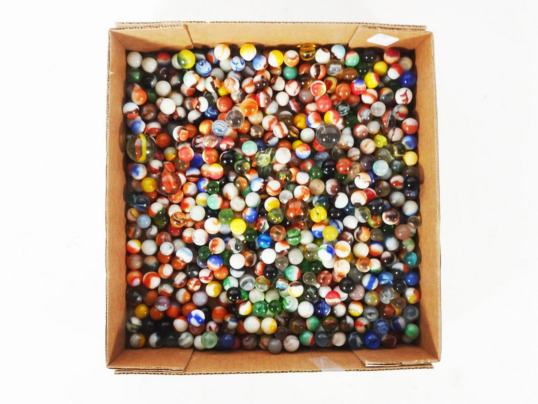 Assorted marbles.: Assorted marbles. They vary in size and decorations. Over 100 marbles.