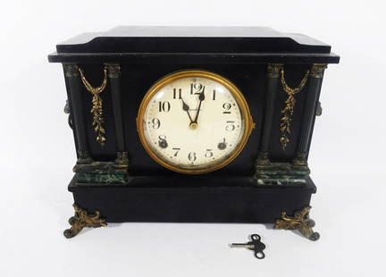 Antique E. Ingraham Company Mantle Clock: Antique E. Ingraham Company S-1824 model mantle clock, early 20th c., black painted wood case with applied brass plated metal columns and garland, brass plated lion heads with rings in mouth on sides,