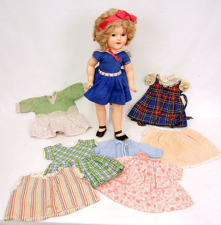 Ideal composition Shirley Temple doll, 19", with s: Ideal composition Shirley Temple doll, 19", with sleep eyes, applied eyelashes, open mouth with teeth, in original tagged clothing, with additional clothing