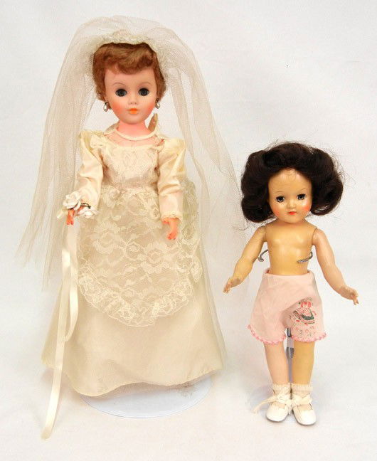 Two dolls: Toni doll by Ideal, 14", hard plastic w: Two dolls: Toni doll by Ideal, 14", hard plastic with green sleep eyes, brunette wig, marked P-90, with shoes and "Thursday" shorts; and a vintage vinyl bride doll, 19", with green sleep eyes, pierced