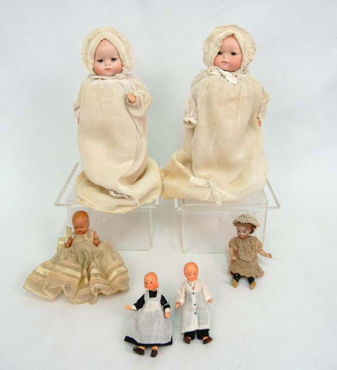 One lot of six dolls, including two Recknagel char: One lot of six dolls, including two Recknagel character baby dolls, 8 1/2" high, both marked Germany O R 127 A, with original clothes (some loss), Nancy Ann Story book doll baby with wrist band, marke