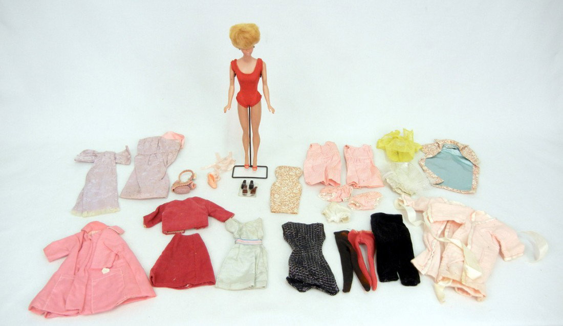 Barbie Blonde Bubble Cut, in original swimsuit, wi: Barbie Blonde Bubble Cut, in original swimsuit, with grouping of Barbie clothing (one coat tagged) and three pair of high heel shoes, 12" high, marked Midge 1962 Barbie 1958