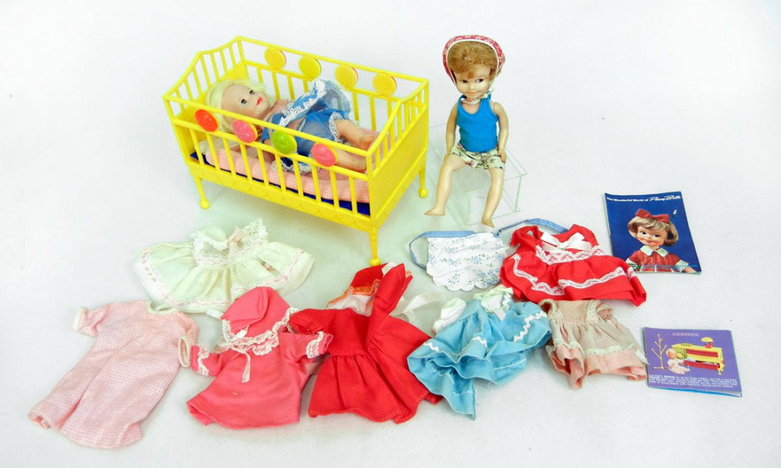 Two dolls - Suzy Cute doll with crib, clothing and: Two dolls - Suzy Cute doll with crib, clothing and booklet, and a Penny Brite doll with additional clothing