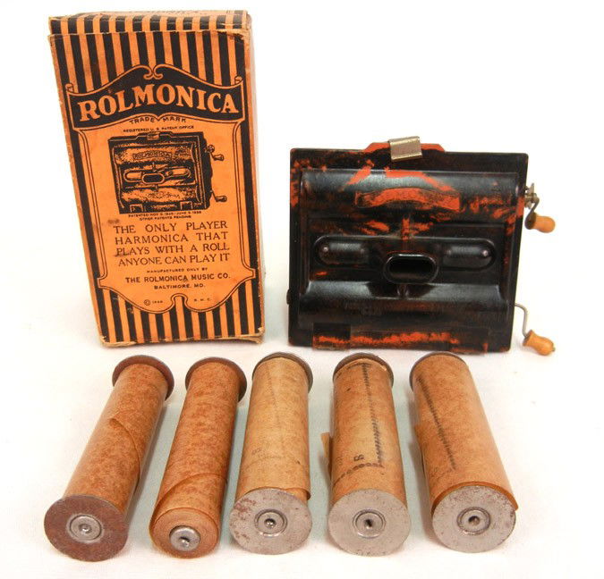 Rolmonica mouth organ, bakelite case, copyright 19: Rolmonica mouth organ, bakelite case, copyright 1926, The Rolmonica Music Co. with six music rolls and original box, 3 1/2" high