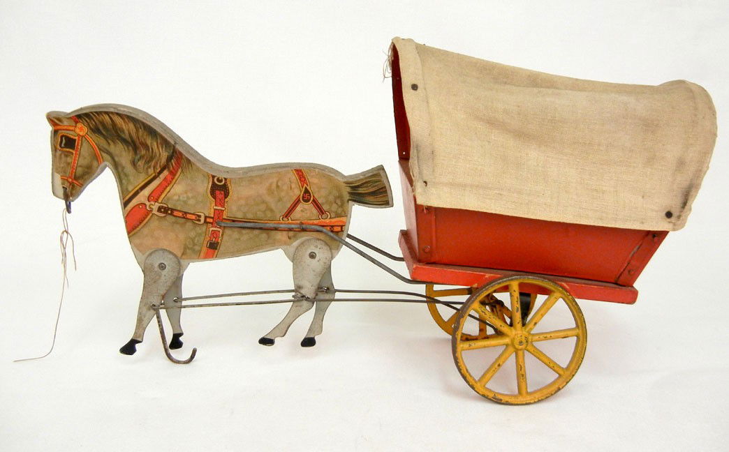 Pull toy, horse drawn covered wagon by Gibbs Mfg.: Pull toy, horse drawn covered wagon by Gibbs Mfg. Co. Canton Ohio, paper litho over wooden horse with painted metal legs, metal and wood cart. Copyright 1910, 9" x 15", maker's name on bottom of horse