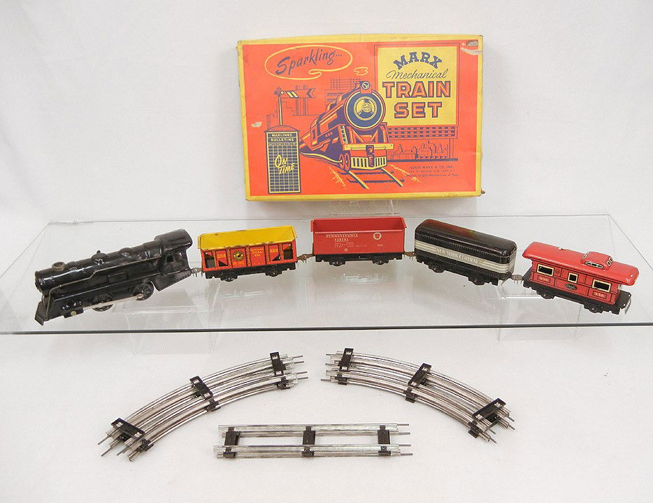 Marx Sparkling mechanical train set in original bo: Marx Sparkling mechanical train set in original box, wind-up engine with New York Central tender, NYC Lines 556 car, Northern Pacific Coal car 554, Pennsylvania 738701 car and track