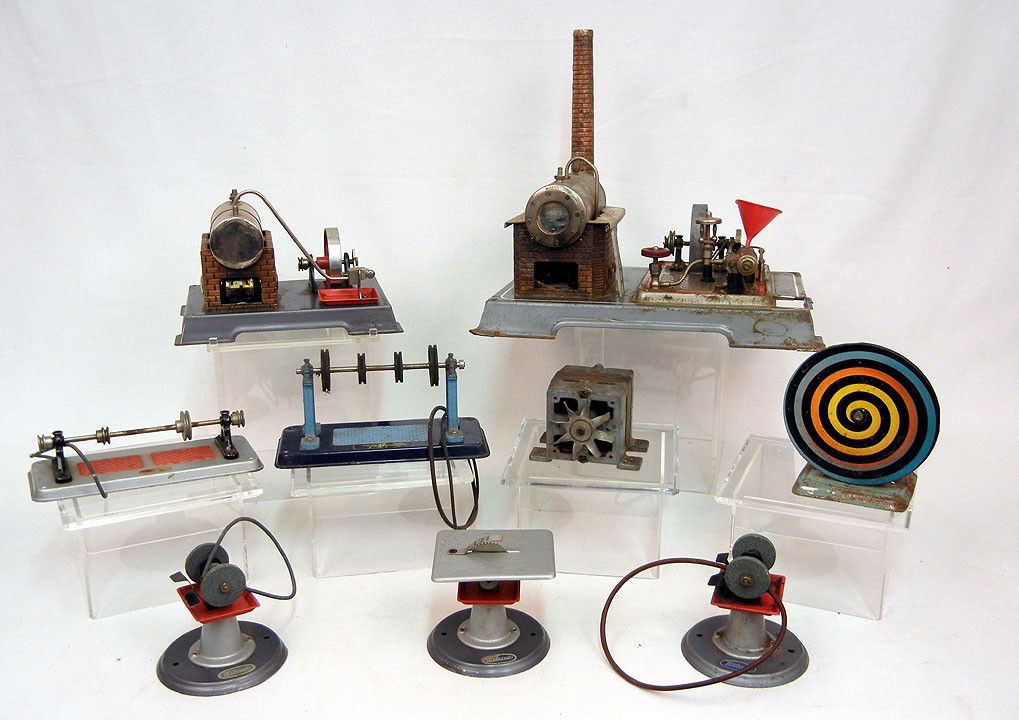 Two steam engines and six steam engine accessories: Two steam engines and six steam engine accessories including fan, grinders, table saw and lathes, all marked Germany or Western Germany, four pieces with Wilesco label