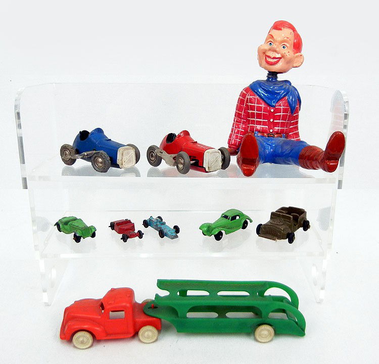 Toy grouping including two Schuco Micro racers wit: Toy grouping including two Schuco Micro racers with keys, unmarked plastic car carrier, two Tootsie toy cars, two Midget toy cars, Lido USA army jeep, and a seated plaster Howdy Doody with spring neck