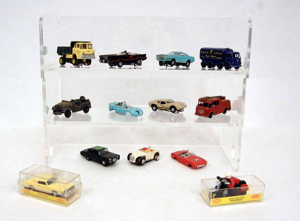Grouping of slot cars, and toy vehicles including : Grouping of slot cars, and toy vehicles including six H.O. gauge slot cars, one is Aurora '67 T-Bird in original box, motorcycle and dump truck, and two slot car bodies, Lesney England metal truck and