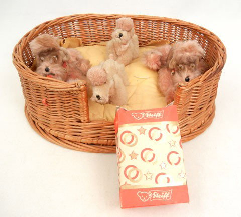 Original FAO 1950's Steiff Exclusive: Original FAO 1950's Steiff Exclusive, sold by FAO Schwartz with original pillow, basket, and dogs, all poodles are Steiff, two larger dogs have Steiff buttons in ears, 4" high, two smaller dogs are un