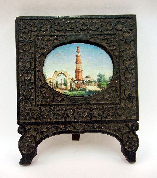 Miniature painting on ivory of an Indian landscape: Miniature painting on ivory of an Indian landscape with buildings, in carved ebony frame with easel back, image size 2 1/2" x 1 3/4", frame size 5 1/2" x 4 1/2", late 19th C.