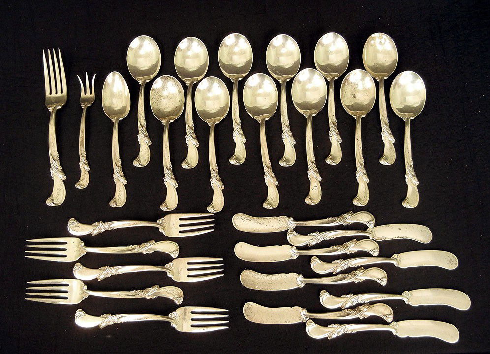 Wallace Silversmiths sterling silver flatware "Wal: Wallace Silversmiths sterling silver flatware "Waltz of Spring" (1952) including twelve cream soup spoons, one teaspoon, one cocktail fork, one dinner fork, four salad forks, and eight butter spreader