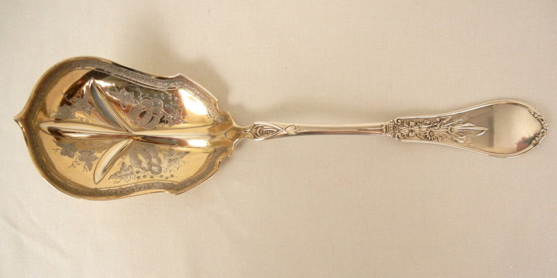 Pure Coin serving spoon by Palmer, Bachelders & Co: Pure Coin serving spoon by Palmer, Bachelders & Co., gold wash on front and back of chased bowl, late 19th C., 9", 2.462 troy oz.