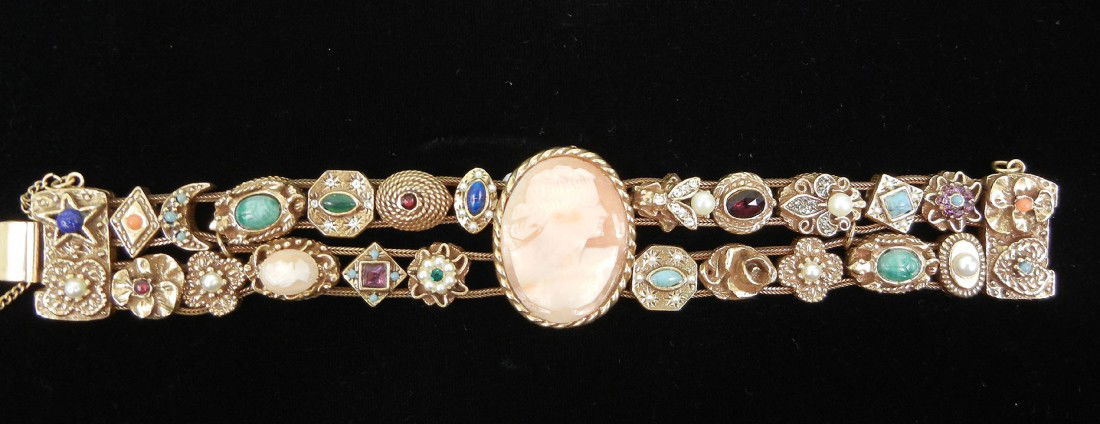 Goldette double slide bracelet with cameo, gold to: Goldette double slide bracelet with cameo, gold tone metal with reproduction Victorian style slides set with faux gems, 7 3/8" long x 1 1/4" wide, genuine carved shell cameo in center, marked Goldette